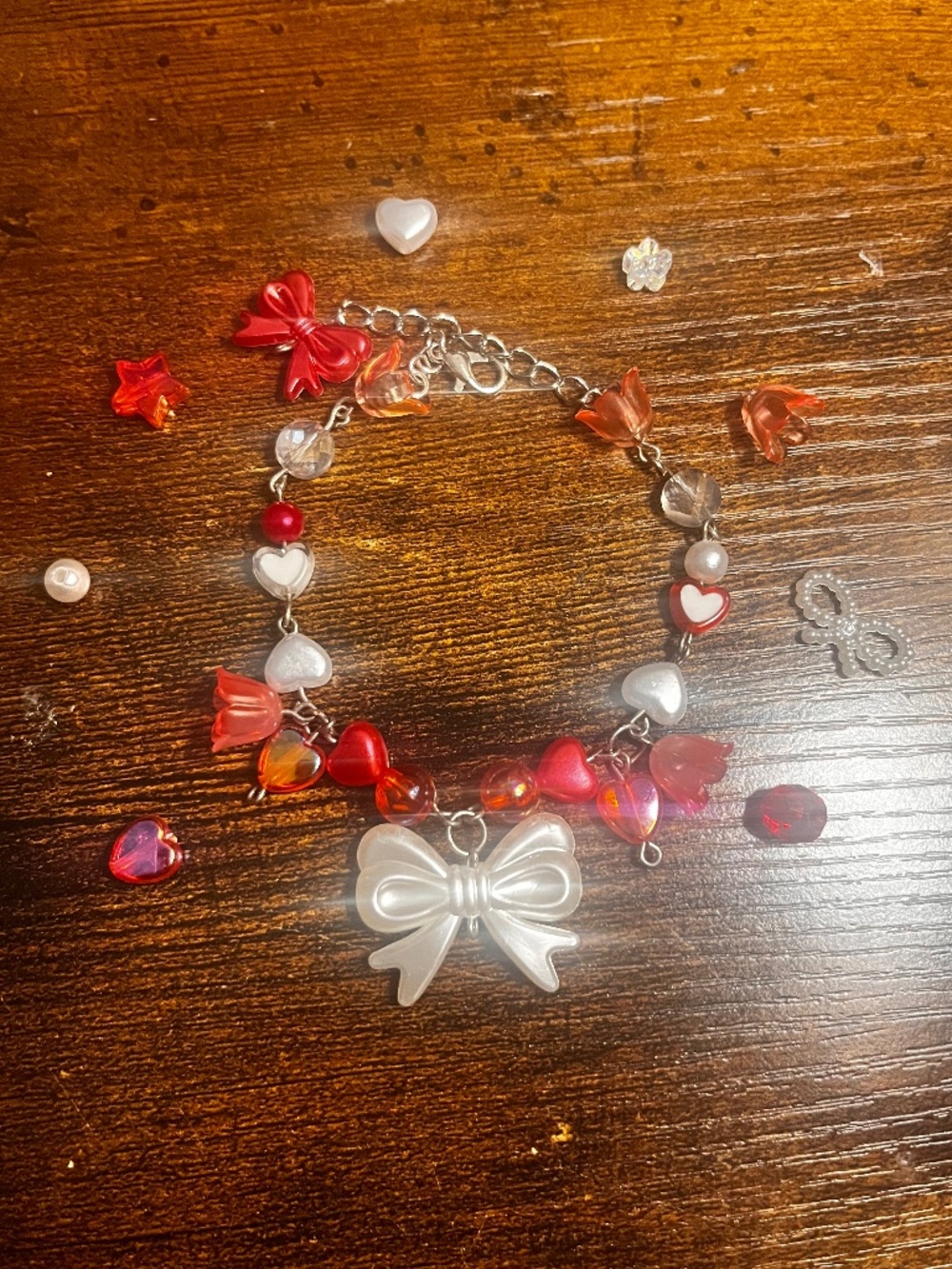 Red and white coquette beaded wire bracelet
